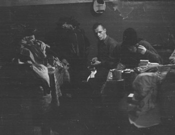 Slobodin (at the table), Dyatlov, Thibeaux-Brignolle, and Dubinina. Visible mandolin (Krivonischenko's) and a knife. Jan 24.