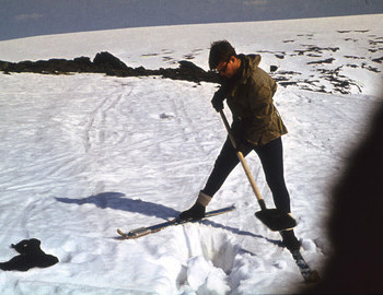 Yuri Kozin excavation snow near where a piece of clothing was found.