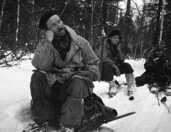  Semyon Zolotaryov, Yuri Doroshenko and Igor Dyatlov (reading the map) on a break on Lozva river on 29 Jan 1959