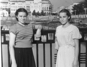 Zina (left) with a friend on the embankment of working youth at the city pond