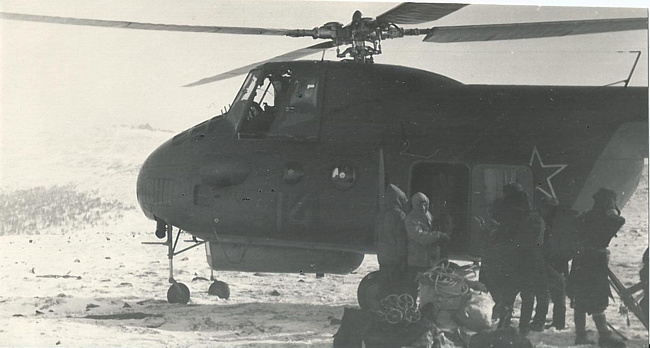 Photo by Grigoriev. Back: "Near height 1079. MI-4 Protyazhenko landing on the pass near height 1079. I flew with him. March 13, 1959"