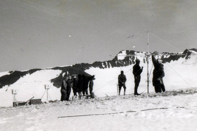 Erecting the surveillance equipment during a test run on Mount McKinley in July 1965