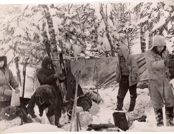 Doroshenko, Kolmogorova (bent down), Zolotaryov, Dubinina and Krivonischenko holding a bucket rather than dusting the stove