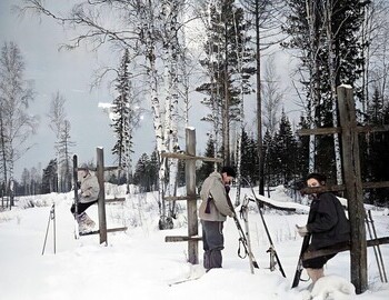Jan 28, 2nd Northern, Dubinina, Zolotaryov, and Kolmogorova cleaning their skis with knives.