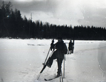 27 Jan 1959 - Lozva river, Zolotaryov, in the background Zina Kolmogorova stands on skis and blocks the figure of Lyuda Dubinina