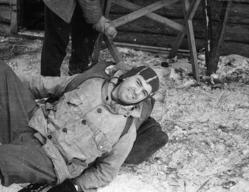 28 Jan 1959 - 2nd Northern, Nikolay Thibeaux-Brignolle lies, smiles and looks at the photographer. Yudin is helping him getting up.