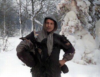 Feb 1, Slobodin in a burned quilted jacket, wearing a watch on his left wrist.
