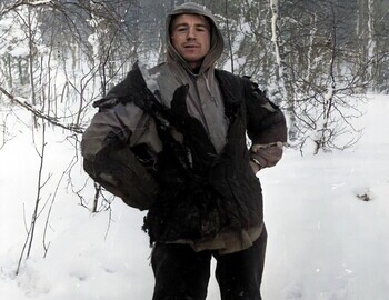Feb 1, Slobodin in a burned quilted jacket, wearing a watch on his left wrist.