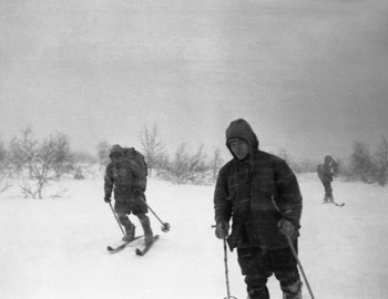 31 Jan 1959 - Auspiya river, Dyatlov (front), Thibeaux-Brignolle (left), Dubinina (right). Strong head wind, hikers are above tree line.