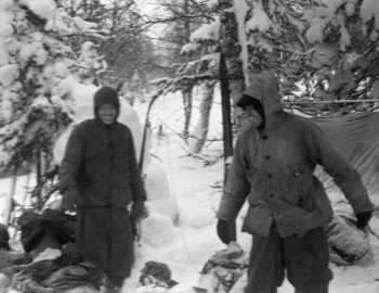 1 Feb 1959 - Auspiya river, Kolevatov and Thibeaux-Brignolle laughing at something, possibly the burnt Doroshenko's sweatshirt that Kolevatov is pointing at.
