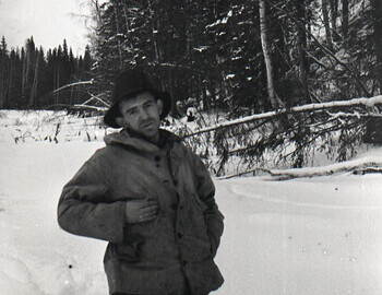 Zolotaryov is shooting Nikolay who looks pathetic, perhaps mocking the girls.