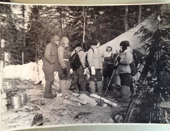 On the back: "At the camp in the valley of the Auspiya river. A group of hikers before going to the mountains. March 1959". 