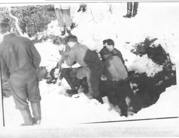 "Colonel Ortyukov, soldiers, Mohov backwards. Presumably the lifting of Kolevatov's body. On the right (covered with snow) - a waterfall and an excavation with bodies." - Mohov's comments from Feb 1, 2012.