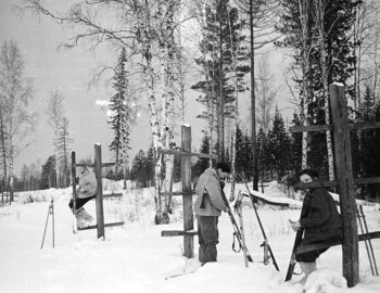2nd Northern. Dubinina, Zolotaryov, and Kolmogorova. Most likely cleaning their skis with knives. Jan 28.