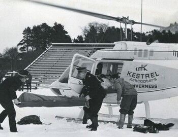The body of one of the victims is lifted from a helicopter in Braemar