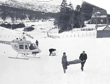 The body of one of the Cairngorm victims is carried from a helicopter at Braemar to a police van bound for Aberdeen