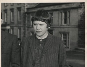 Survivor 15 year old Raymond Leslie, photographed with heavy mitts protecting his frostbitten hands, after giving evidence at the inquiry in Banff in 1972