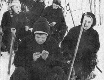 On the second row are Tregubov (the leader of the group) and Zina writing in her diary.