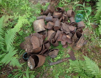 Tin cans and an axe found in the area where the winter searchers camp must have been in 1959.