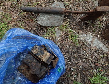 Batteries and axe found in the area where the winter searchers camp must have been in 1959.