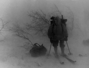 In the photo is Rustem Slobodin, on his shoulders there is a backpack with a pair of felt boots, a handle of an ax sticks out from the backpack.