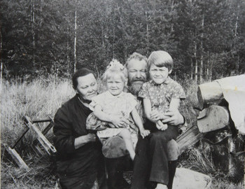 Kurikov Ivan and Mary with grandchildren, Lena and Sasha. Garevka.