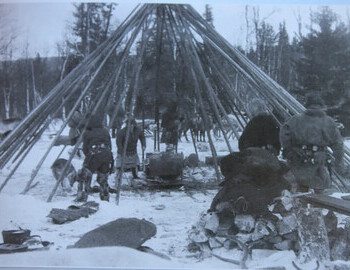 Сеттинг уп а chum. First the stakes, then stove, mats, skins, clothes, dishes, etc. Тhen the chum is covered with skins from the outside and inside.