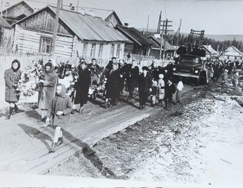 A funeral passing on Pokryshkina St infront of the "Hotel"