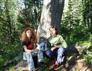 Teodora Hadjiyska and Ayna Gaysin at the cedar with book "1079"
