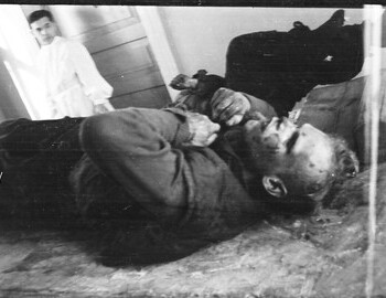 Igor Dyatlov and Zina Kolmogorova (her legs visible) in Ivdel morgue, in the back Korotaev or Laptev, 4 Mar 1959