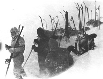 "Setting up the tent". Far left: Krivonischenko. Close with his back turned is presumably Slobodin; further (in dark) is Kolevatov.