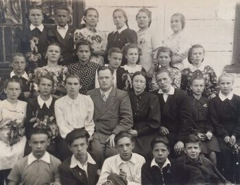 1953 (spring). 8th grade, school №44, in the first row, first on the left is Yuri Doroshenko. Joining the Komsomol.
