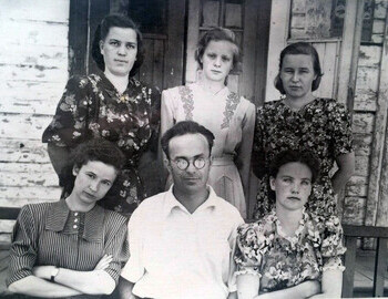 1954 University graduates R.L. Levina (first row, left), E.M. Petrova, T.A. Isakova, Iya Vitalievna Melehina (second row, second), Z.M. Pashnikova with director G.A. Osipov